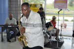 LYNX Operator Charles Collins performs a saxophone solo in the lobby of LYNX Central Station.