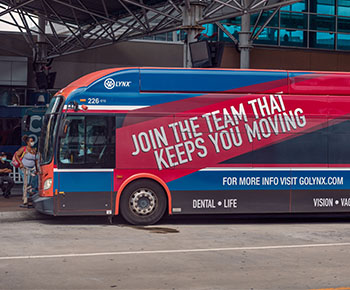 LYNX bus with Join the team that keeps you moving wrap
