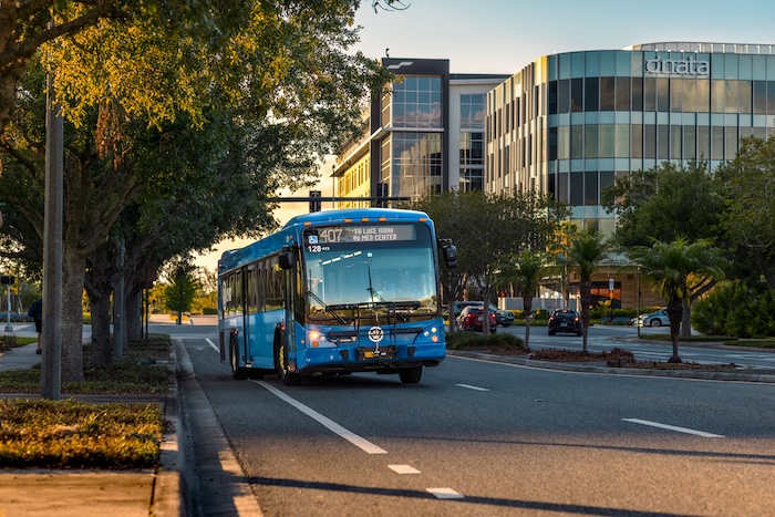 LYNX bus traveling on a city street in downtown Orlando