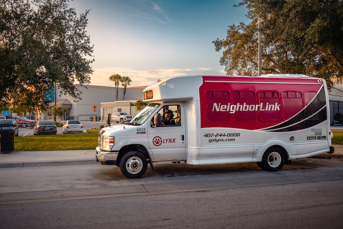 NeighborLink shuttle driving on a city street