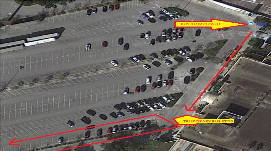 aerial shot of parking lot with arrow pointing to closed bus stop and another arrow pointing to the temporary bus stop